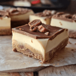 A decadent 5-Ingredient No-Bake Kinder Bueno Slice with a buttery biscuit base, creamy Kinder Bueno, and white chocolate topping.