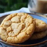 Close-up of thick and chewy peanut butter cookies with peanut butter chips on a plate