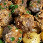 Lovely Slow Cooker Garlic Butter Beef Bites & Potatoes with a crispy topping, tender beef, and seasoned potatoes for a delicious comfort food meal.