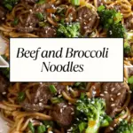 A plate of beef and broccoli noodles stir-fried in a savory sauce, garnished with sesame seeds and green onions.