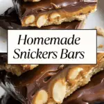 A stack of homemade Snickers bars with layers of chocolate, caramel, peanuts, and nougat, with a text overlay that reads "Homemade Snickers Bars.
