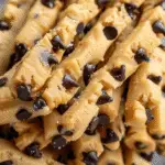 Close-up of raw cookie dough twists studded with semi-sweet chocolate chips.